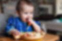 Baby boy eating finger food and mix vegetable plate.Baby led weaning (BLW) self feeding.mi