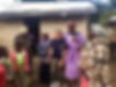 Mercys smile staff laughing with kenyan family in village
