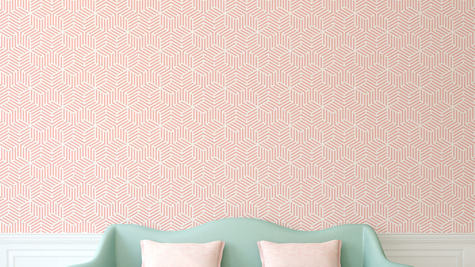 Pastel pink patterned wallpaper with geometric design behind a mint green couch and two pale pink cushions, creating a calm ambiance.