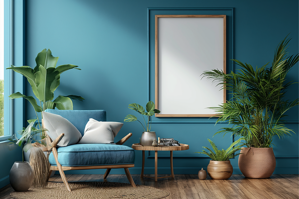 Blue room with armchair, cushions, plants, and a side table. Walls, baseboards, and window trim all painted the same colour blue. Calm and cozy ambiance.