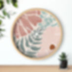Bloom Wall Clock | Floral wall clock with a natural wood frame. Pink, green, and brown tones.