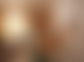 Woman checking thermostat while air conditioner runs in sunlit home