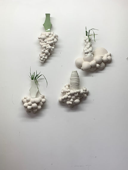 bubble terracotta shelves with porcelain vases