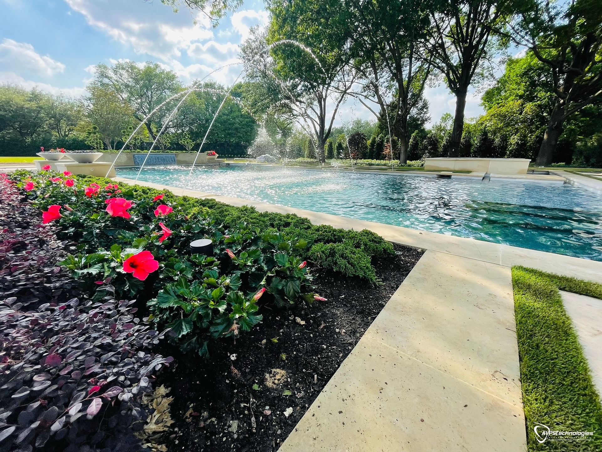 Radiance Speakers in flowerbed by pool