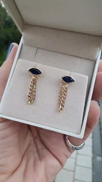 Thumbnail: 14k yellow gold eye earrings with a drop chain inlaid with lab sapphires