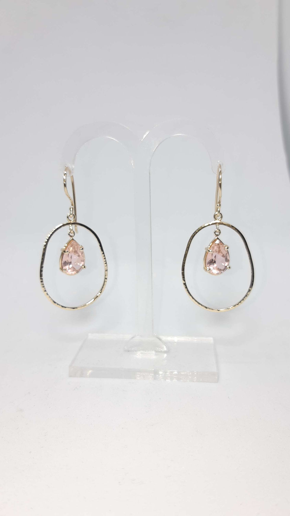 Thumbnail: Large gold earrings in 14k yellow gold with drop-shaped Morganite stones.