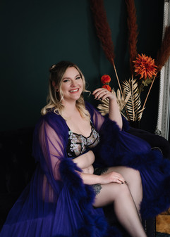 A bride-to-be is posing at her Boudoir photoshoot which is for her wedding gift. Her photoshoot is at Emerald Photography Studio in Falkirk, Scotland, UK.