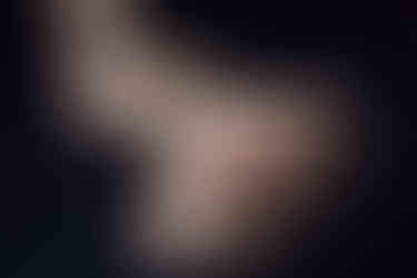 A bride-to-be is posing at her Boudoir photoshoot which is for her wedding gift. Her photoshoot is at Emerald Photography Studio in Falkirk, Scotland, UK.