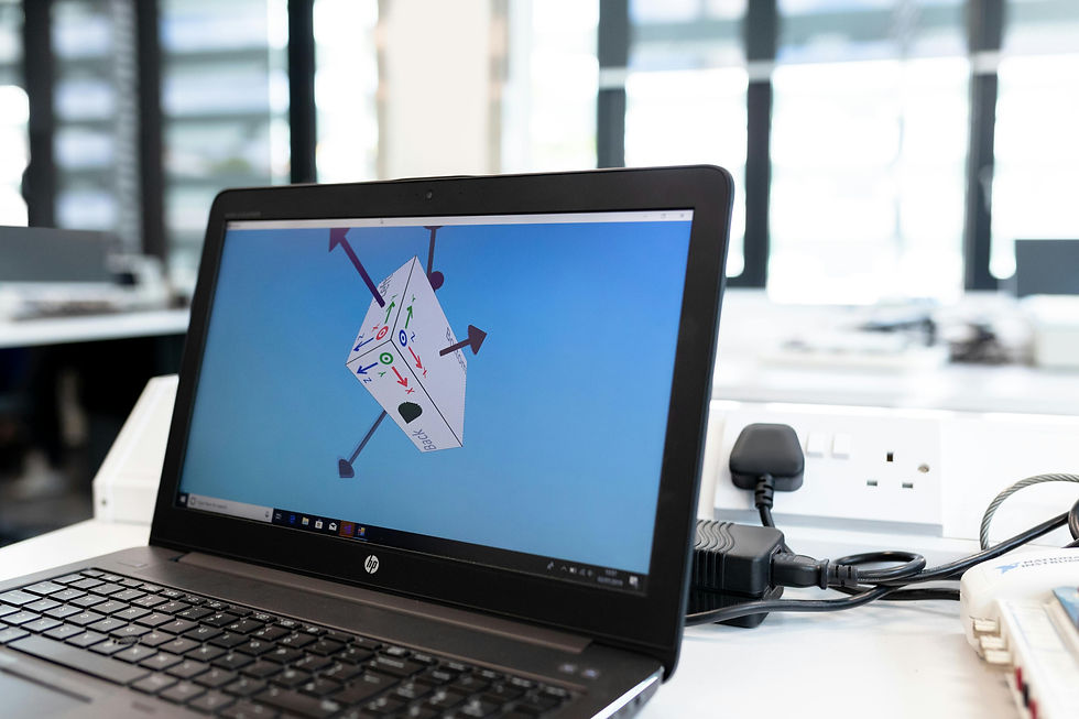 A computer screen displaying a 3D cube-like object designed using game development software.