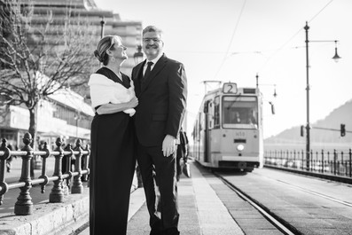 happy elopement couple posing in front of a historical tram in Budapest