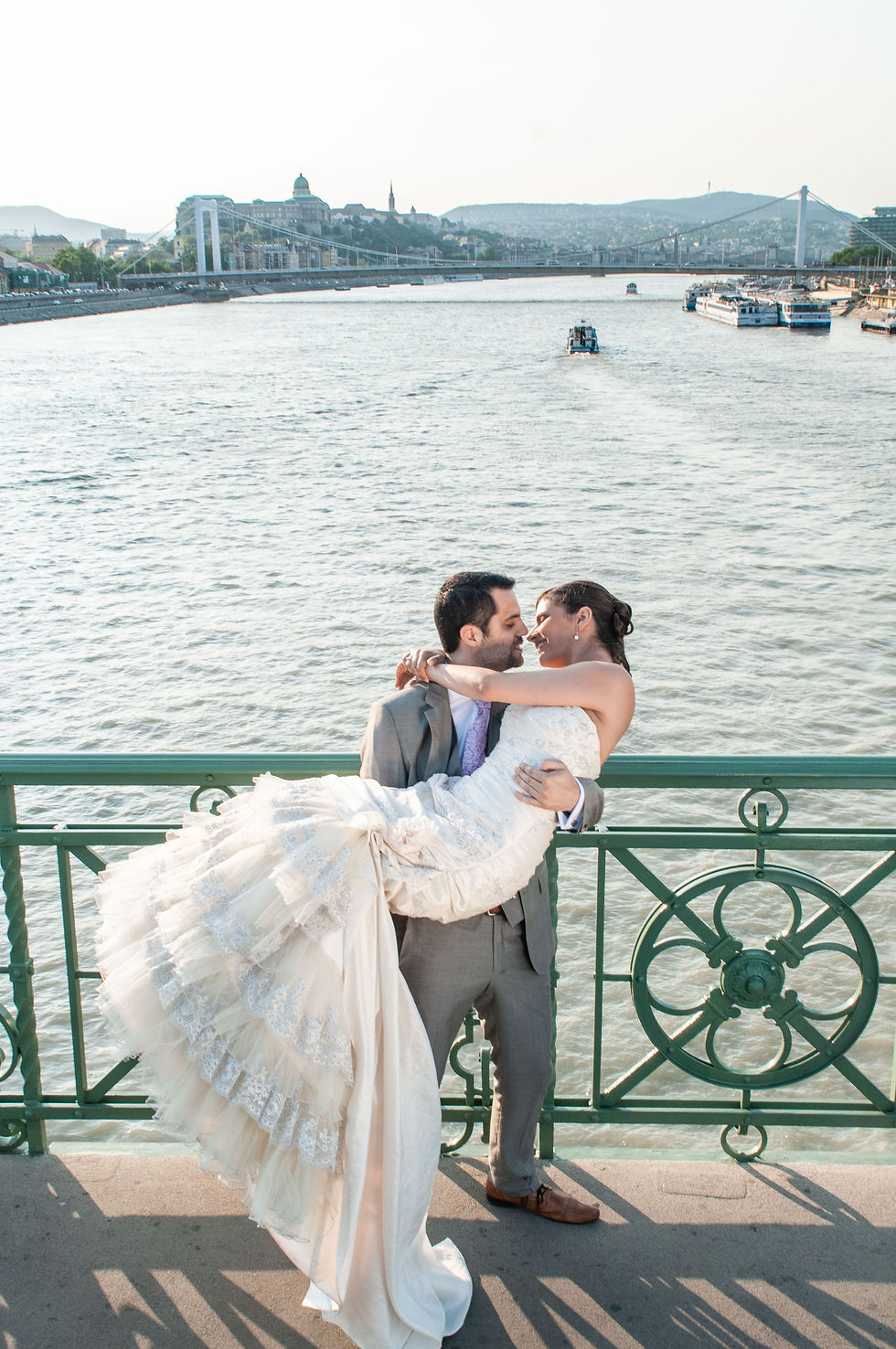 Photograph of Eloping couple on of the bridges of Budapest - a very beautiful city to elope