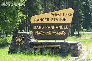 sign with a forest on the background