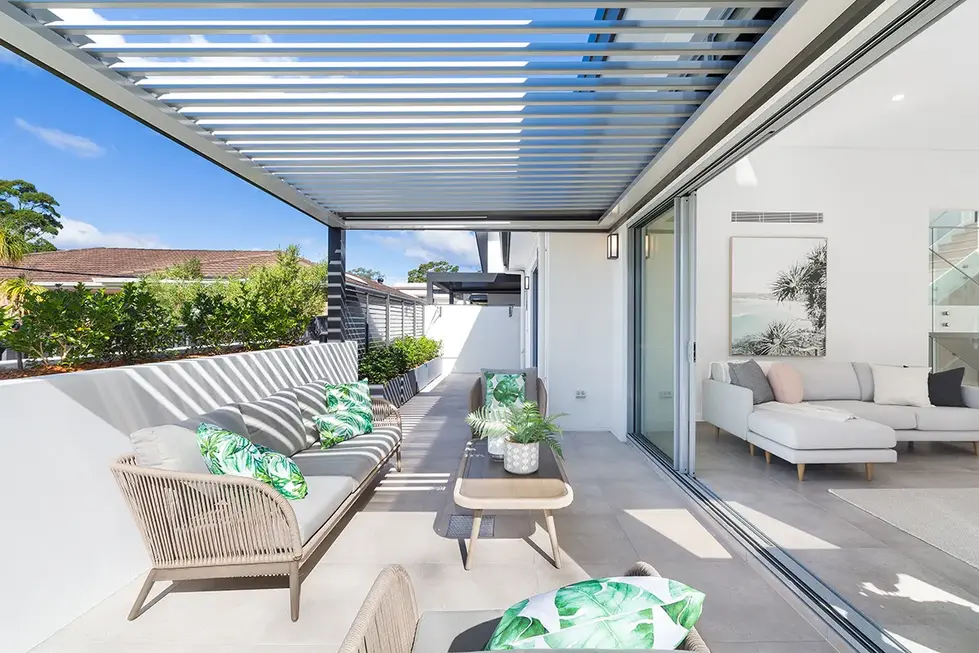 Outdoor patio with retractable roof, seating area, and views.






