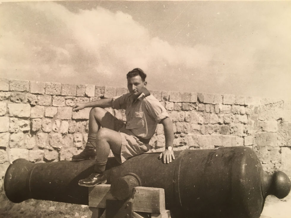 Yeshayahu (Shaike) Landau sitting on a historic cannon, 1947