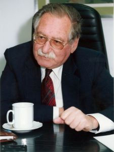 Photograph of David Rotlevy seated at a desk