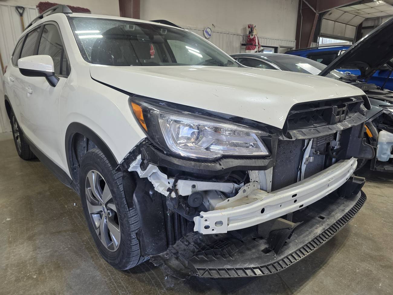Subaru with front end damage before repair