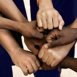 Team Putting Fists Together In Huddle_edited_edited