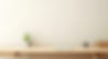 ai-generated-an-empty-desk-sitting-next-to-the-living-room-wall-free-photo.jpg