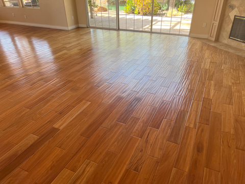 Durable wood-look laminate flooring installed in a high-traffic living room by Apflooringsd