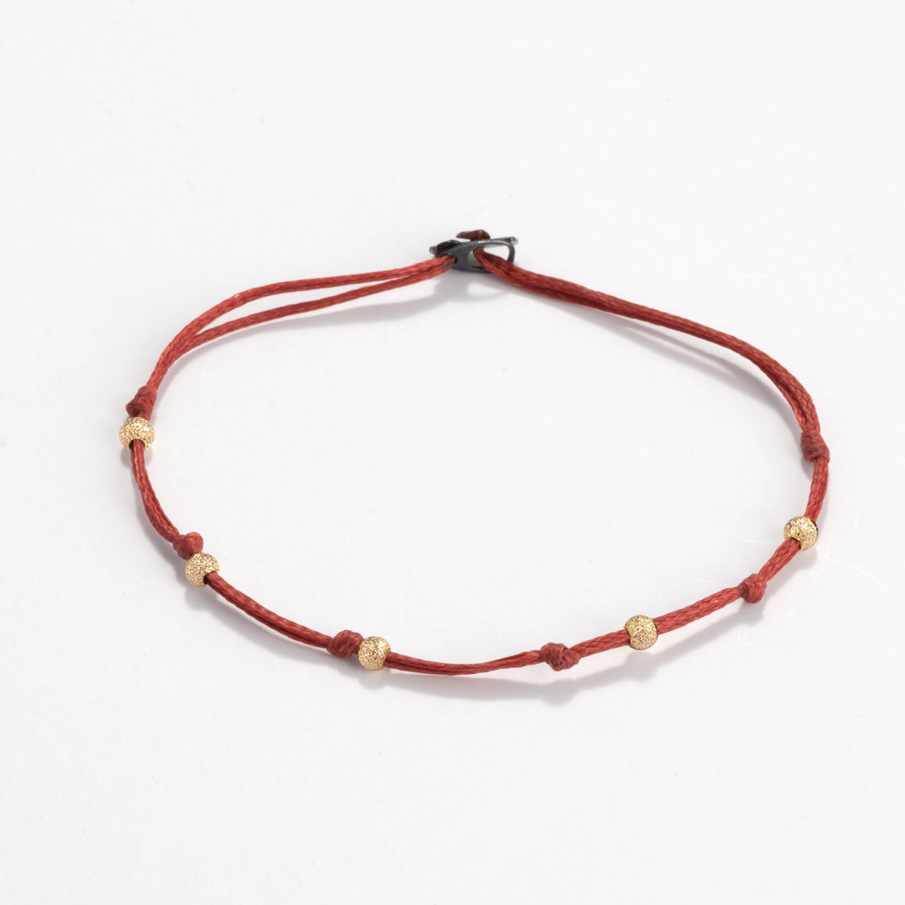Oskar Gydell - Cord bracelet with gold beads
