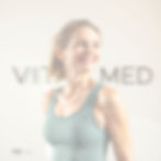 Clean, modern photo of a healthy woman in her 40s in athletic wear, looking energized and