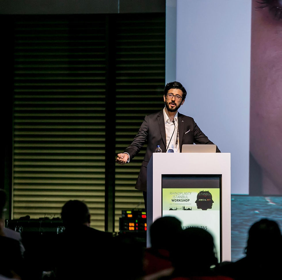 dr suleyman tas stage speaking photo.jpeg