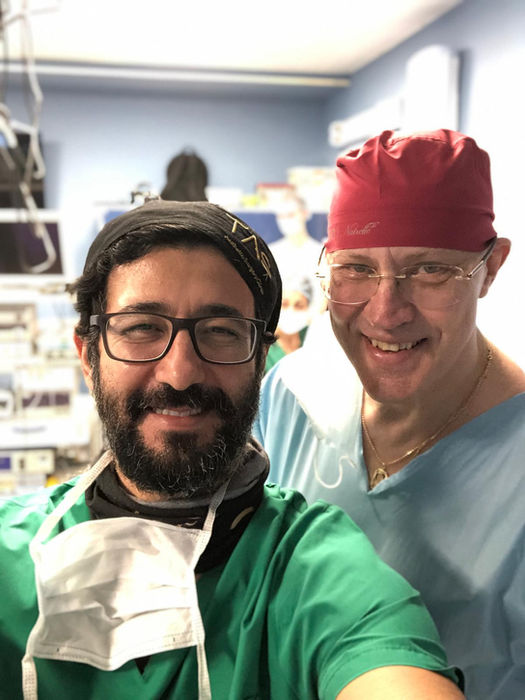 Prof. Dr. Suleyman Tas with another surgeon in a clinical environment