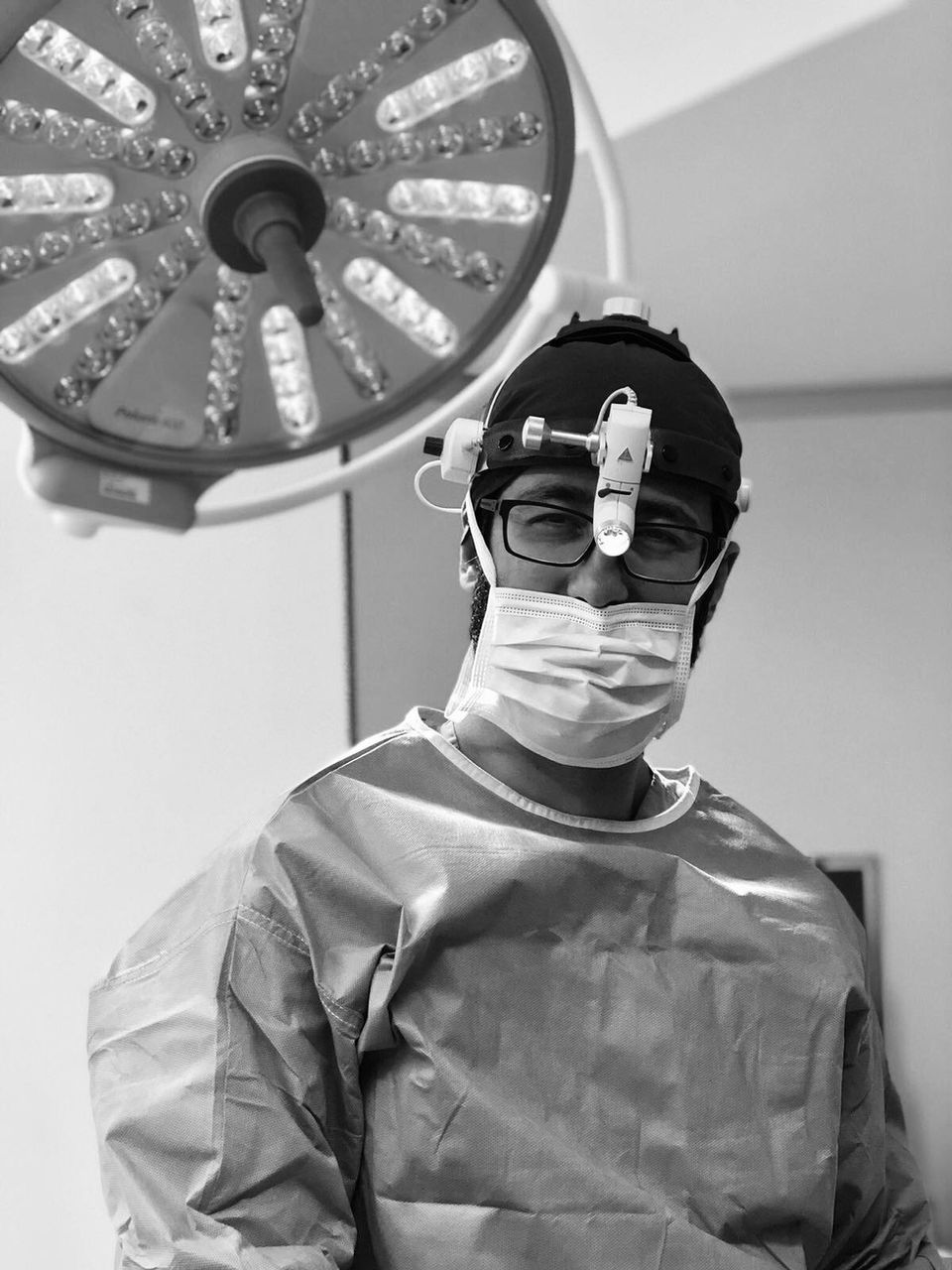 Prof. Dr. Suleyman Tas performing surgery in a clinical environment