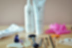 Skincare products, gua sha, face roller, and various beauty tools