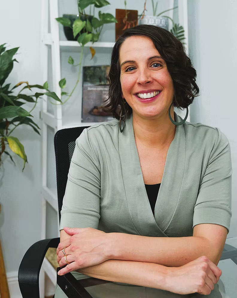 Smiling female psychotherapy professional in her office