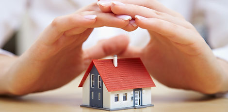 Female hands saving small house with a roof_edited_edited.jpg
