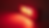 Close-up view of a red light therapy device emitting gentle red light
