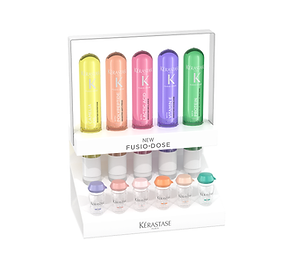 Kérastase Fusio-Dose display with colorful hair treatment vials and corresponding booster bottles.