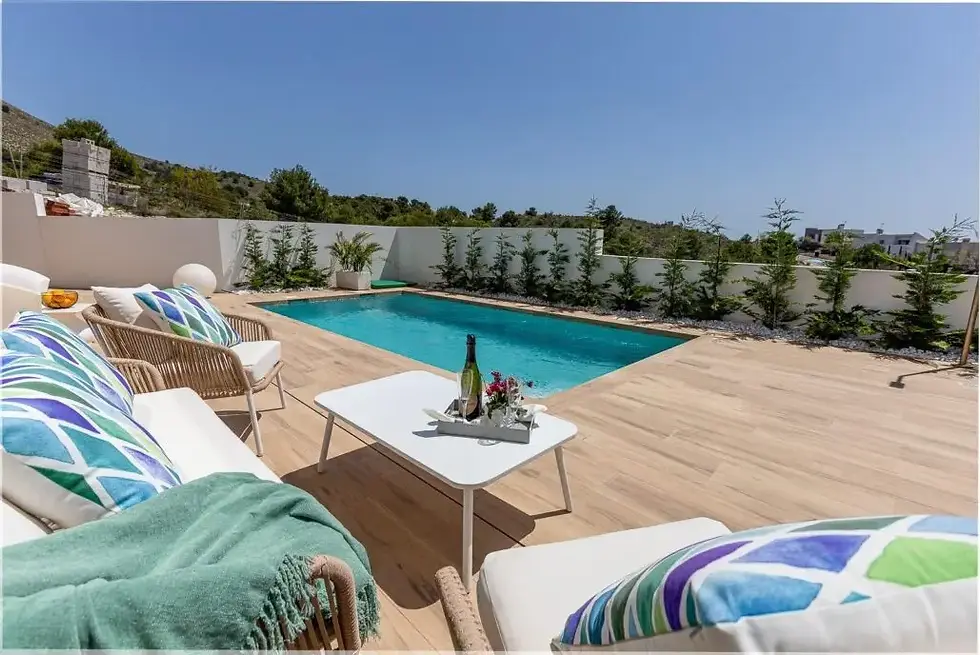 NEW BUILD VILLAS IN BALCON DE FINESTRAT
New Build modern villas in Balcon de Finestrat.
Wide and bright villas with 3 bedrooms and 2 bathrooms, open plan kitchen with living-dining area, beautiful terrace, private garden with the pool and parking space.
Combination of wood and natural stone makes the house modern and rustic at the same time.
Villas located 10 minutes from Benidorm and only 2 km from Finestrat. The ride to Tierra Mitica where you can spend nice time with family will take 6 minutes. This location makes it a great choice for a holiday home.
Finestrat located in the Marina Baixa region of the Costa Blanca, close to neighbouring Benidorm and about 40 kilometres from the city of Alicante and the international airport.
The village is situated on the mountainside of Puig Campana and offers beautiful views of the mountains, the coast and the Mediterranean Sea.
Benidorm is just a five-minute drive from the properties and offers all the services you would need including shops, bars, restaurants, supermarkets, banks, pharmacies and several private international schools.
Close to the beaches of Levante, Poniente and Cala de Finestrat, with more than 6km in length that are among the best in Europe awarded by the European Union with Blue Flags.
All leisure services such as the theme parks of Aqua Natura, Terra Mítica, Terra Natura, Aqualandia and Mundomar, Sierra Cortina and Villaitana Golf courses, hiking and climbing in Puig Campana an incomparable natural setting or enjoy of nautical sports.