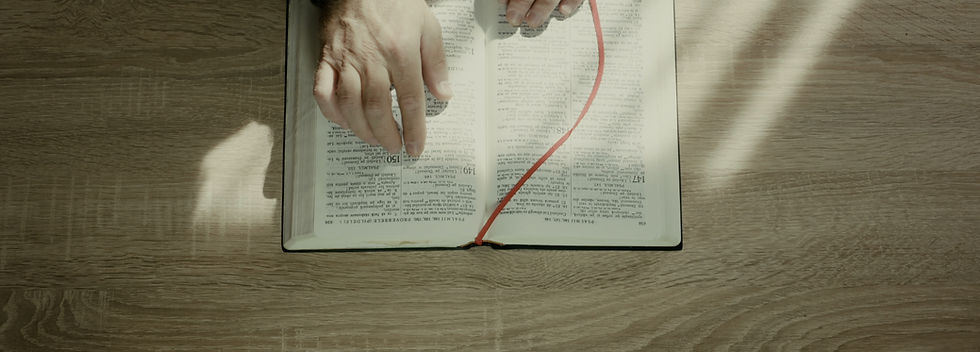 man-reading-and-praying-on-the-bible-SBI-351416150.jpeg