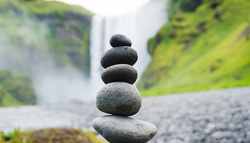 Stacked Stones Near Waterfall