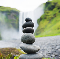 Stacked Stones Near Waterfall