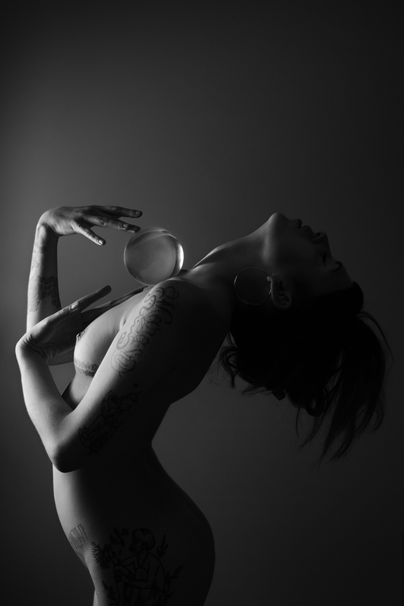 crystal ball sliding on woman's chest