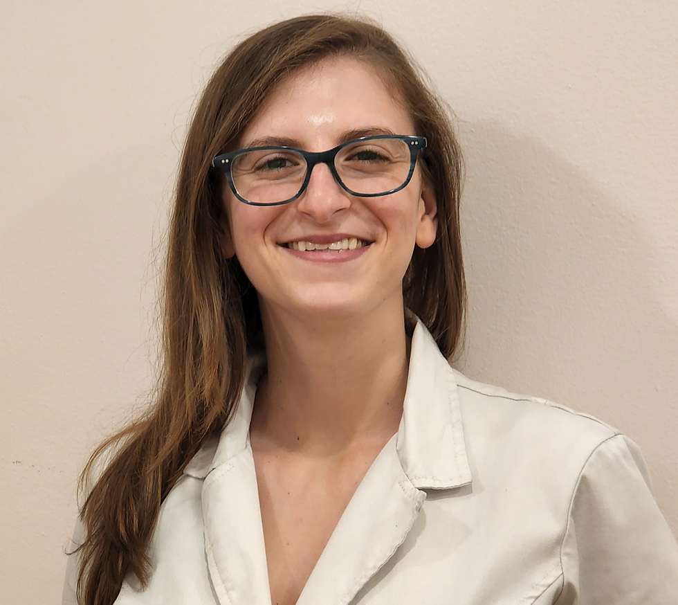 A portrait of Jordan, a white woman wearing glasses with brown hair.