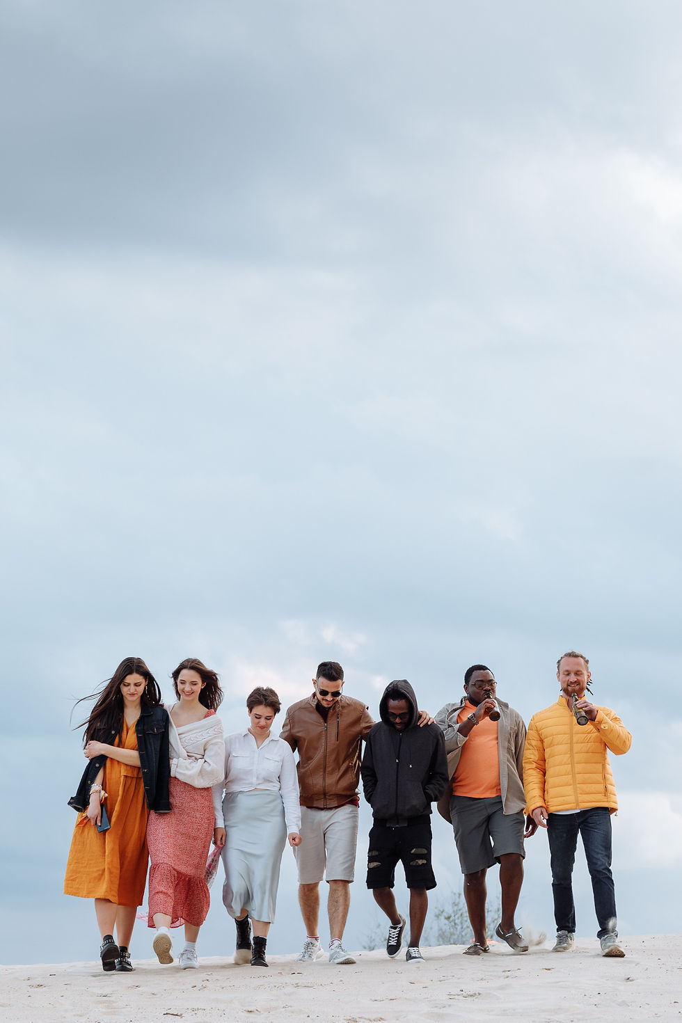 A group walking on the beach