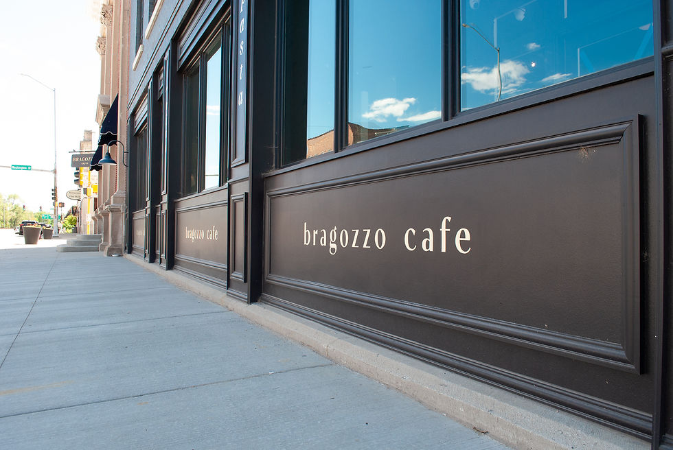 sign painting logos on exterior of building