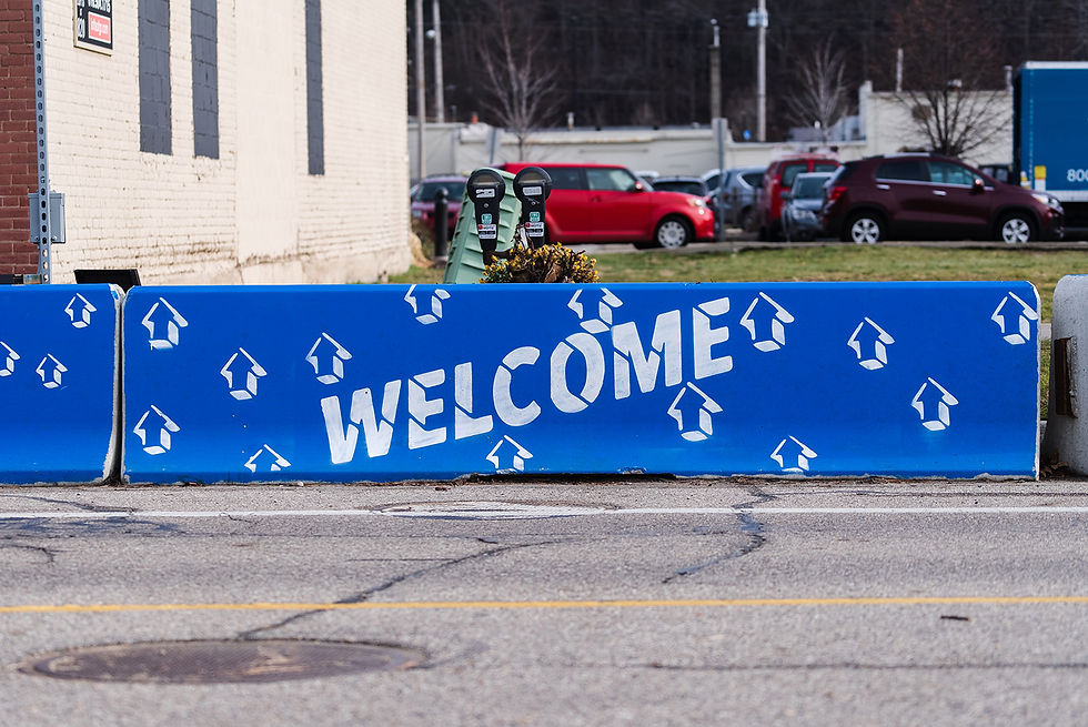 stencil of Welcome painted in North Monroe, Grand Rapids