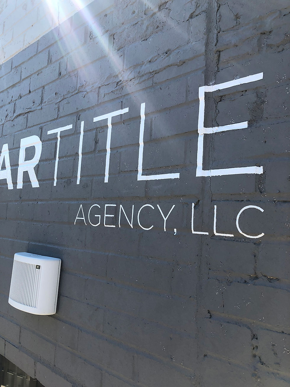 sign painting on brick wall