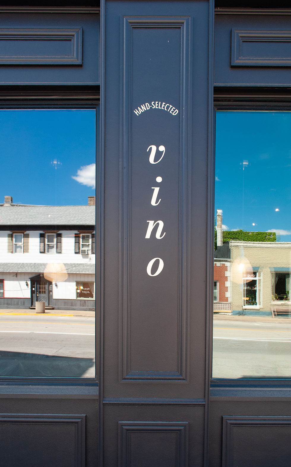 sign painting vino on exterior