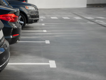 Rows of parked cars in a clean facility, providing a top parking option for your Toyota Center visit at Clay Garage.
