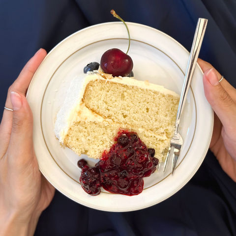 coconut cake with coconut buttercream and berry compote 