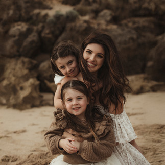 Family playing outdoors during golden hour, dressed in soft neutral tones – Nicole Peters Photography