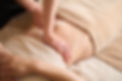 A woman receiving a belly massage at a beauty salon.jpg