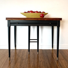 Mid Century Modern expanding console table. Natural finish top with painted base and legs using Jet Black One Hour Enamel by Wise Owl Paint