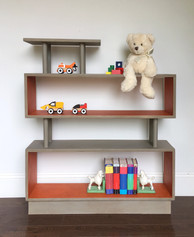Open bookshelf in mid century modern style, painted with Mandarina and Gray Linen Chalk Synthesis Paint by Wise Owl Paint
